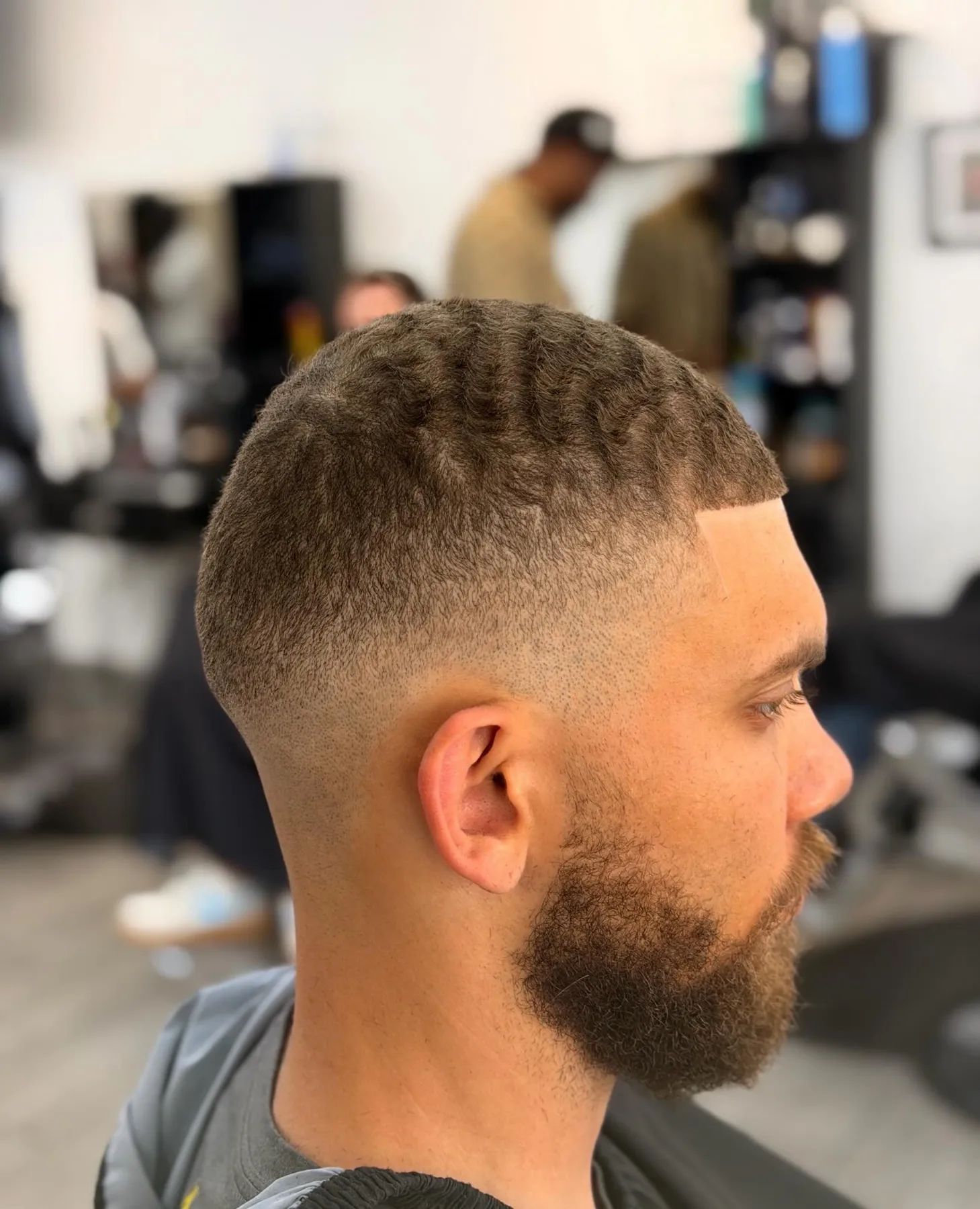 Low skin fade with a full beard at VIP Barber Lounge, Denver & Aurora