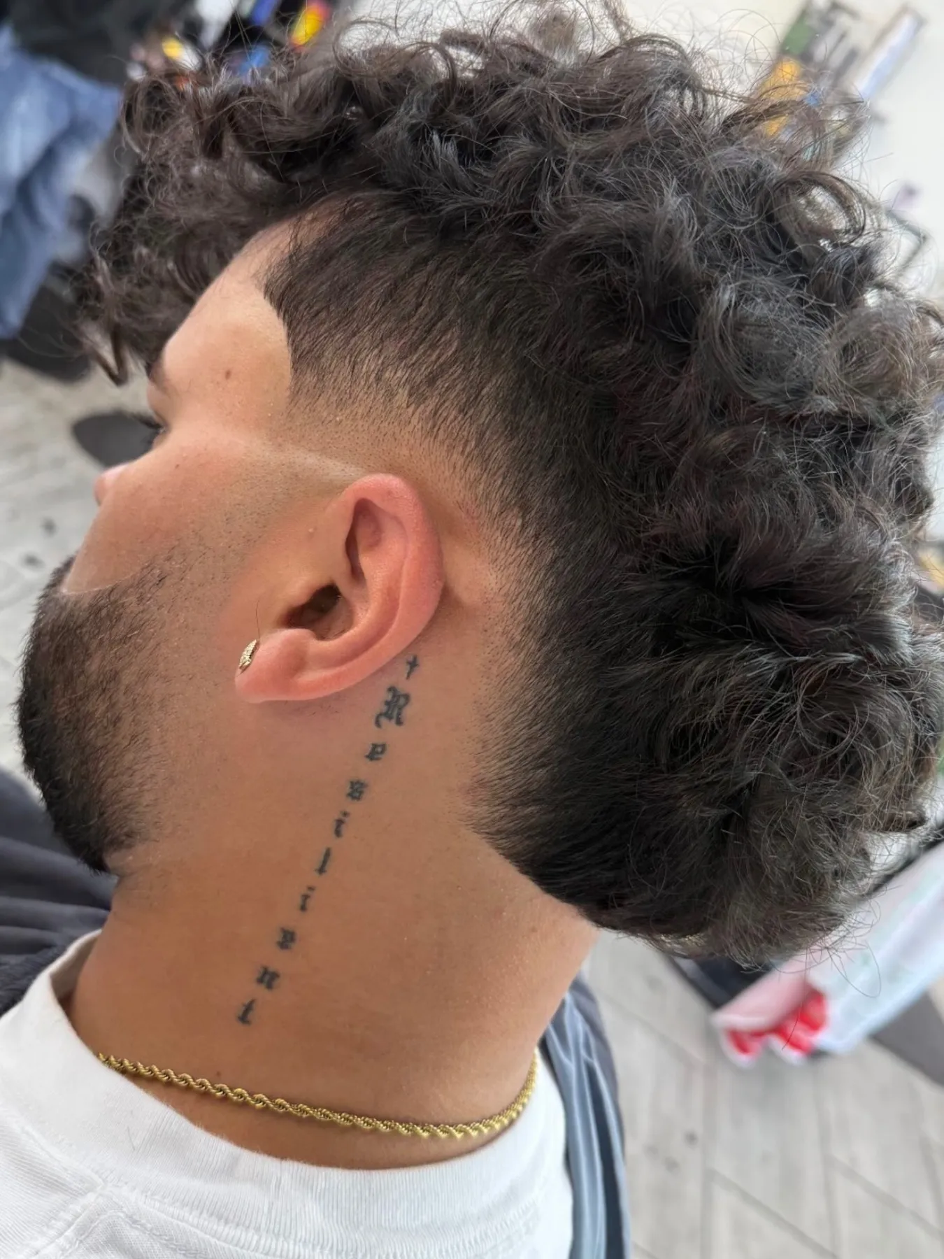 Curly burst fade with a clean neckline at VIP Barber Lounge, Denver & Aurora