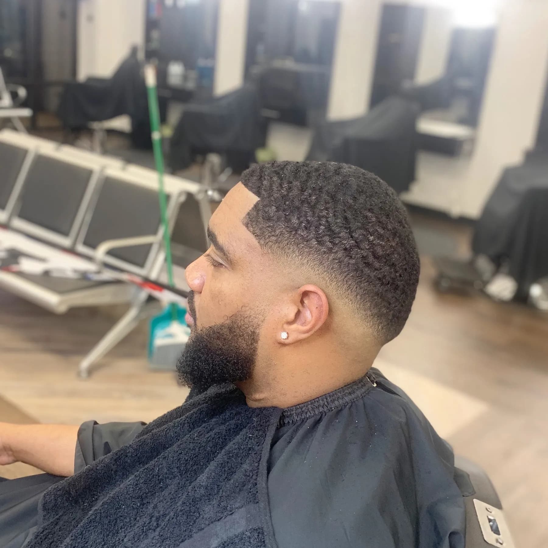 Skin fade with a full beard at VIP Barber Lounge Aurora